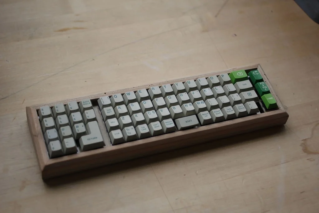 Early prototype of a PCGear keyboard on a workbench.